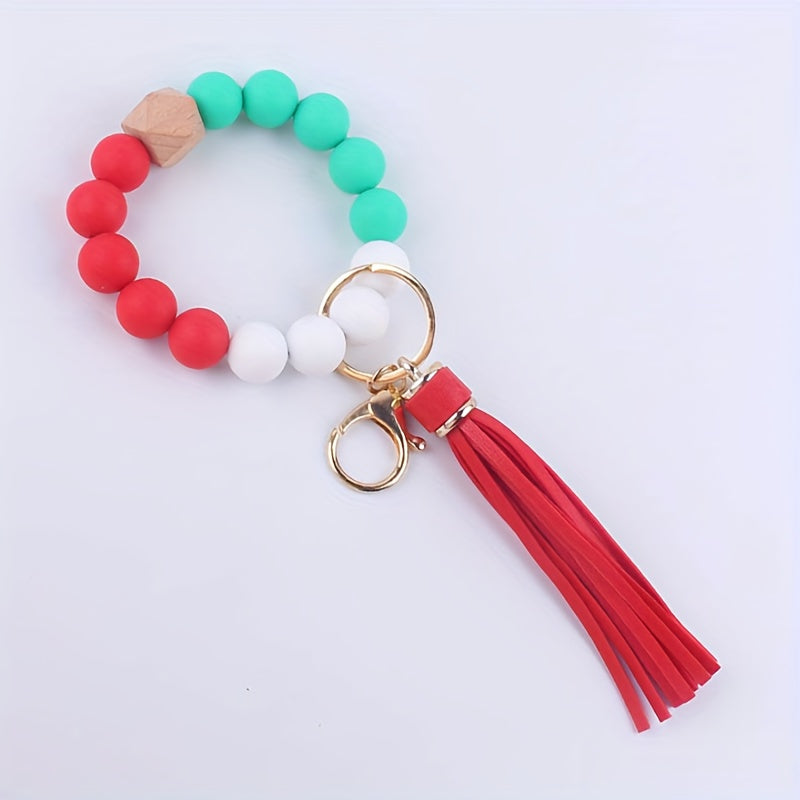 Colorful beaded keychain with a red tassel on a white background