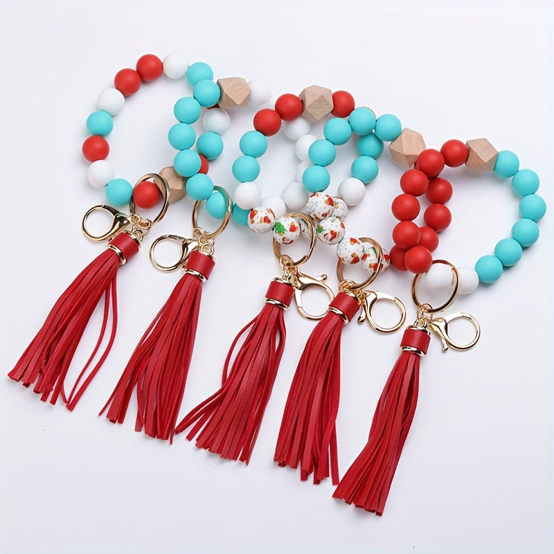 Set of colorful beaded keychains with tassels on a white background