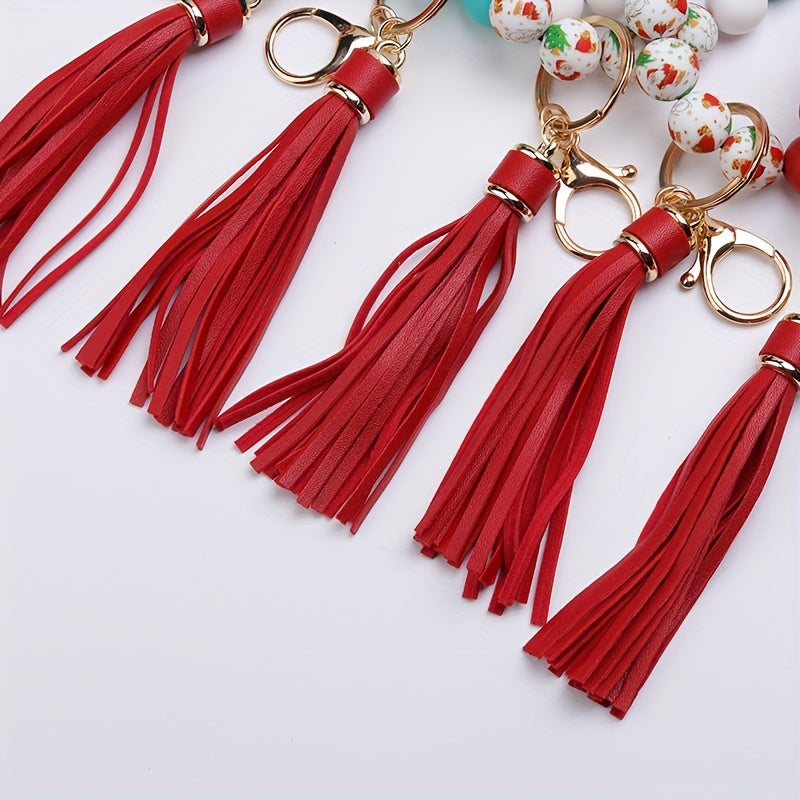 Red tassel keychains with gold clasps on a white background
